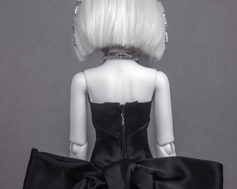 Black satin bow at the back of a gown